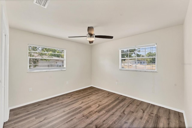 4907 4th Avenue Cir NW, Bradenton, FL 34209 - spare room with a wealth of natural light, baseboards, visible vents, and wood finished floors