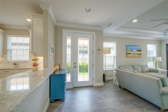 5301 Bartolomeo St, Sarasota, FL 34238 - entryway featuring plenty of natural light, ornamental molding, baseboards, and recessed lighting