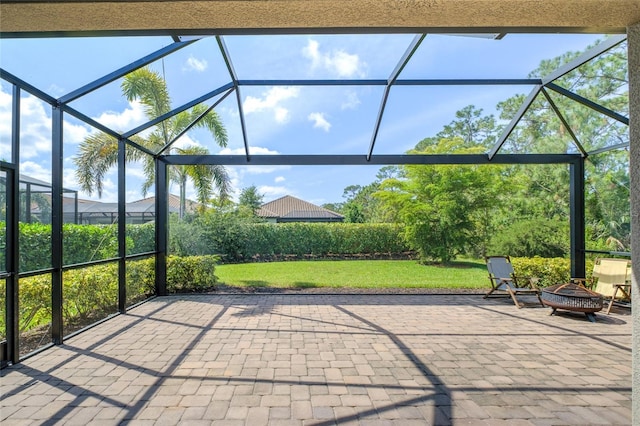 5301 Bartolomeo St, Sarasota, FL 34238 - view of patio with an outdoor fire pit and glass enclosure