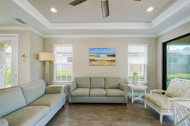 5301 Bartolomeo St, Sarasota, FL 34238 - living area featuring a ceiling fan, a tray ceiling, healthy amount of natural light, crown molding, and recessed lighting