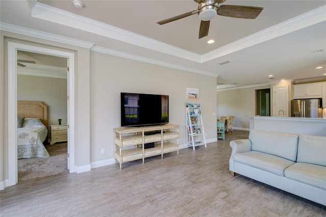 5301 Bartolomeo St, Sarasota, FL 34238 - living area with ceiling fan, a tray ceiling, ornamental molding, baseboards, and recessed lighting