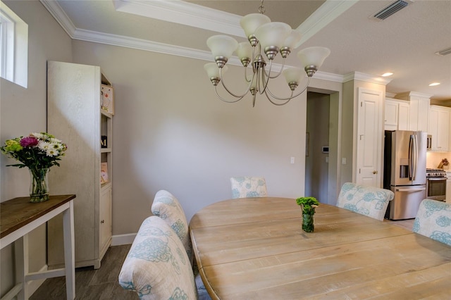 5301 Bartolomeo St, Sarasota, FL 34238 - dining area featuring a chandelier, crown molding, baseboards, wood finished floors, and recessed lighting