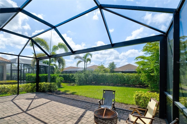 5301 Bartolomeo St, Sarasota, FL 34238 - unfurnished sunroom with a fire pit
