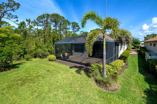 5301 Bartolomeo St, Sarasota, FL 34238 - back of house with a patio, a yard, and a lanai