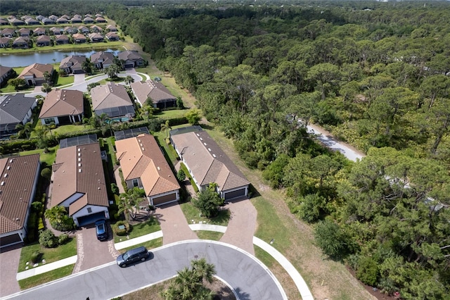 5301 Bartolomeo St, Sarasota, FL 34238 - aerial overview of property's location featuring a heavily wooded area, nearby suburban area, and a large body of water