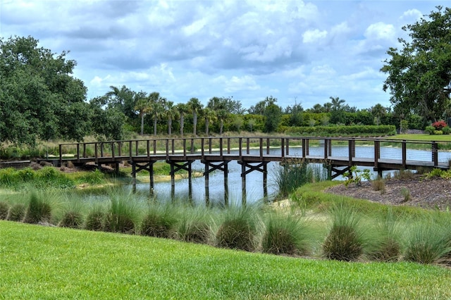 5301 Bartolomeo St, Sarasota, FL 34238 - dock featuring a water view and a yard