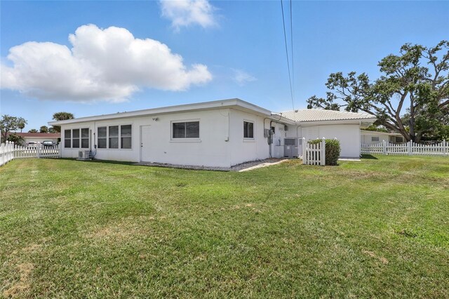 3105 Gulfgate Dr, Sarasota, FL 34231 - back of house featuring central air condition unit and stucco siding