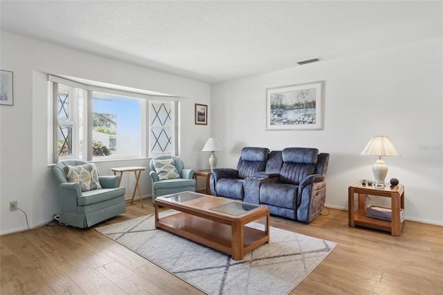 3105 Gulfgate Dr, Sarasota, FL 34231 - living area with light wood finished floors and baseboards