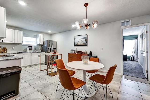 4542 19th Ave S, Saint Petersburg, FL 33711 - dining area featuring an inviting chandelier, visible vents, baseboards, light tile patterned flooring, and recessed lighting