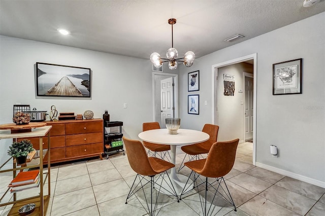 4542 19th Ave S, Saint Petersburg, FL 33711 - dining room with light tile patterned floors, baseboards, an inviting chandelier, and visible vents