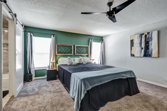 4542 19th Ave S, Saint Petersburg, FL 33711 - bedroom featuring a textured ceiling, carpet flooring, baseboards, and a ceiling fan