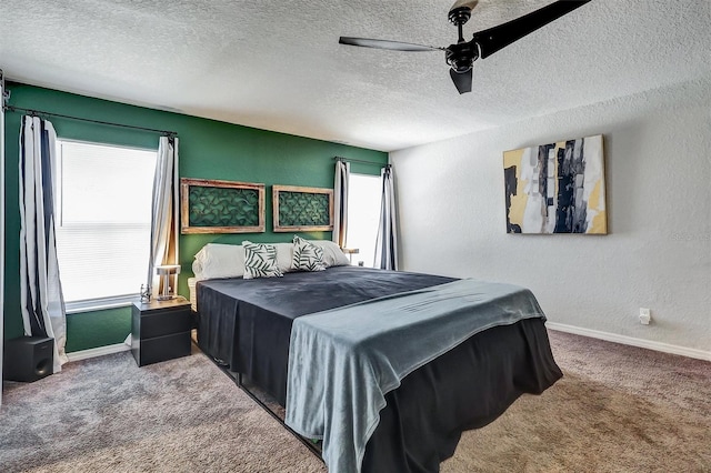 4542 19th Ave S, Saint Petersburg, FL 33711 - bedroom featuring baseboards, a textured ceiling, ceiling fan, and carpet floors