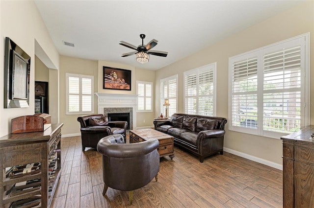 13167 Fernando St, Venice, FL 34293 - living room with ceiling fan, a fireplace, healthy amount of natural light, and wood finished floors