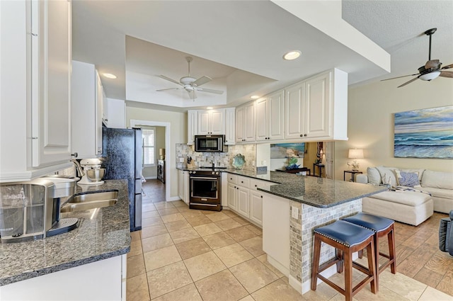 13167 Fernando St, Venice, FL 34293 - kitchen featuring appliances with stainless steel finishes, ceiling fan, a peninsula, open floor plan, and recessed lighting