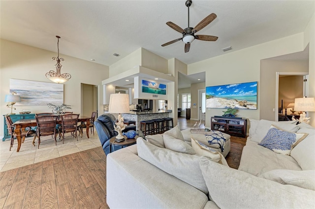 13167 Fernando St, Venice, FL 34293 - living room with ceiling fan, wood finished floors, and vaulted ceiling