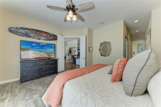 13167 Fernando St, Venice, FL 34293 - bedroom featuring wood finished floors, baseboards, recessed lighting, and ceiling fan