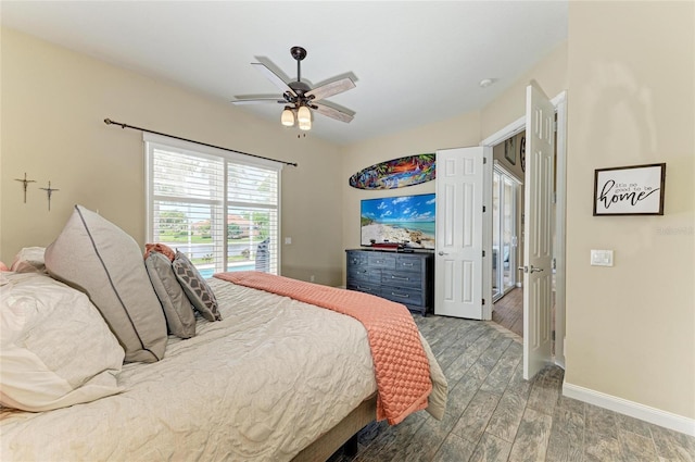13167 Fernando St, Venice, FL 34293 - bedroom featuring baseboards, ceiling fan, wood finished floors, and access to outside