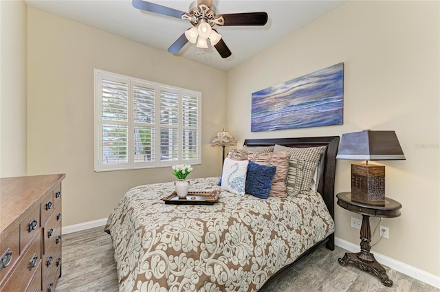 13167 Fernando St, Venice, FL 34293 - bedroom with baseboards, ceiling fan, and wood finished floors