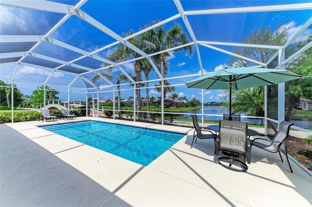 13167 Fernando St, Venice, FL 34293 - swimming pool with a patio area, a water view, and glass enclosure