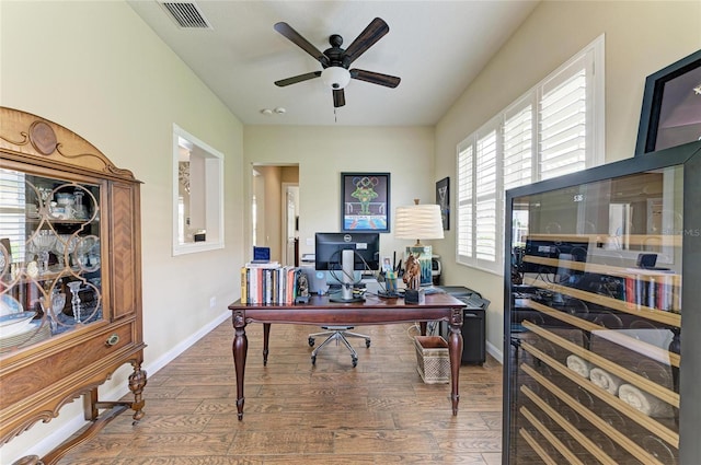 13167 Fernando St, Venice, FL 34293 - office featuring wood finished floors, ceiling fan, and baseboards