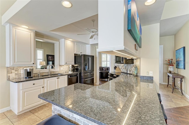 13167 Fernando St, Venice, FL 34293 - kitchen with high end refrigerator, a sink, dishwashing machine, plenty of natural light, and recessed lighting