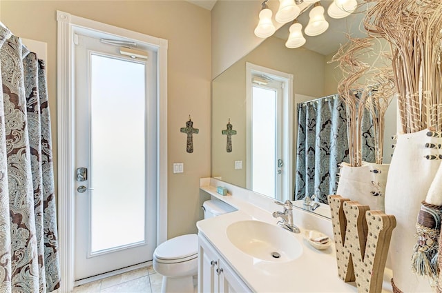 13167 Fernando St, Venice, FL 34293 - bathroom with vanity, toilet, and tile patterned floors
