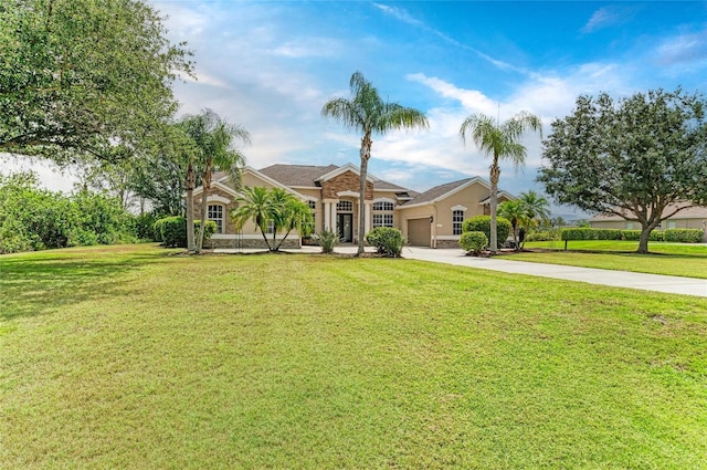 8103 Snowy Egret Pl, Bradenton, FL 34202 - view of front of property with driveway, a garage, a front yard, and stucco siding