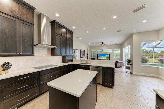 8103 Snowy Egret Pl, Bradenton, FL 34202 - kitchen with wall chimney exhaust hood, black electric cooktop, dishwasher, a peninsula, and a ceiling fan