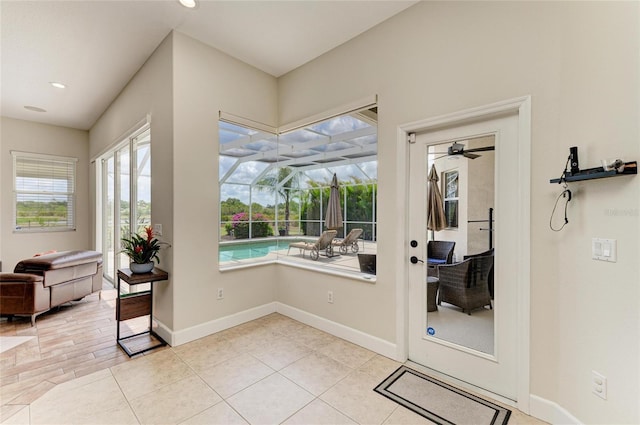 8103 Snowy Egret Pl, Bradenton, FL 34202 - entryway with a sunroom, baseboards, recessed lighting, a ceiling fan, and light tile patterned flooring
