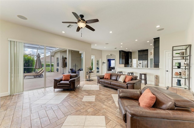 8103 Snowy Egret Pl, Bradenton, FL 34202 - living room with a ceiling fan, recessed lighting, and baseboards