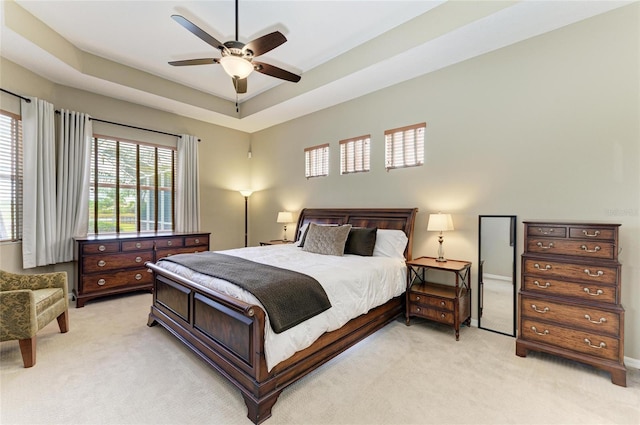 8103 Snowy Egret Pl, Bradenton, FL 34202 - bedroom featuring light colored carpet, ceiling fan, and a raised ceiling