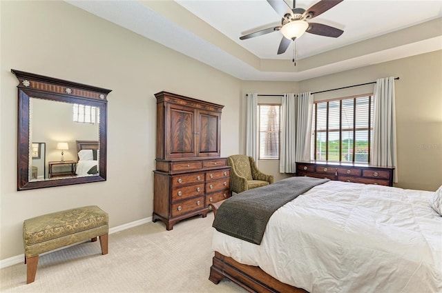8103 Snowy Egret Pl, Bradenton, FL 34202 - bedroom featuring light carpet, baseboards, and multiple windows