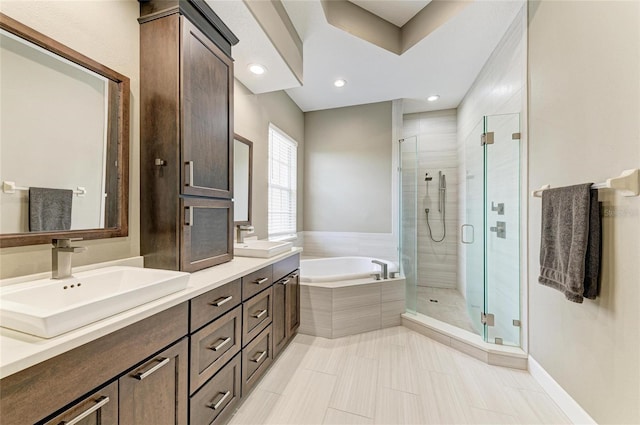 8103 Snowy Egret Pl, Bradenton, FL 34202 - bathroom with a bath, a stall shower, double vanity, tile patterned flooring, and recessed lighting