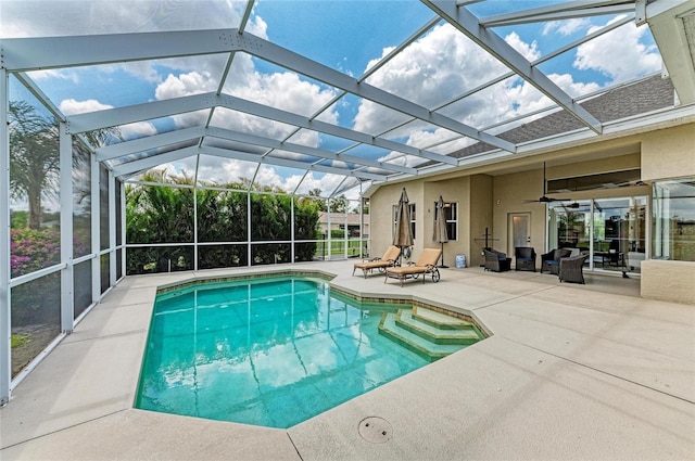 8103 Snowy Egret Pl, Bradenton, FL 34202 - outdoor pool featuring a patio area, a ceiling fan, and glass enclosure