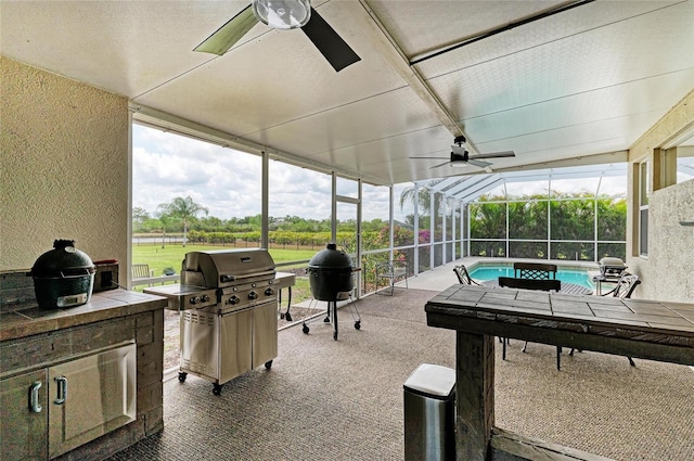 8103 Snowy Egret Pl, Bradenton, FL 34202 - view of patio featuring a ceiling fan, an outdoor pool, glass enclosure, and area for grilling