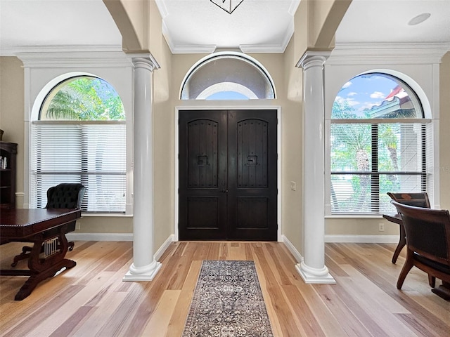 6567 Eagle Ridge Way, Lakeland, FL 33813 - entryway with decorative columns, baseboards, light wood-type flooring, and crown molding