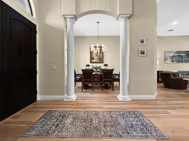 6567 Eagle Ridge Way, Lakeland, FL 33813 - entryway with decorative columns, baseboards, ornamental molding, light wood-type flooring, and recessed lighting
