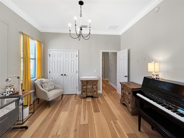 6567 Eagle Ridge Way, Lakeland, FL 33813 - sitting room with a chandelier, light wood-style flooring, crown molding, and baseboards