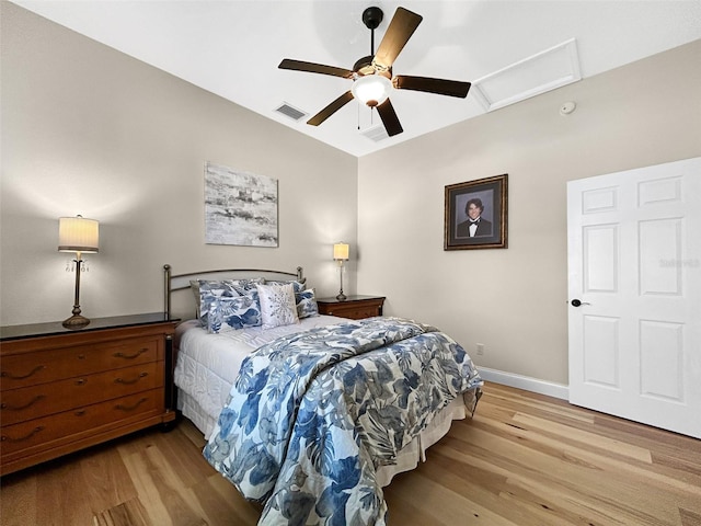 6567 Eagle Ridge Way, Lakeland, FL 33813 - bedroom with light wood-type flooring, attic access, baseboards, lofted ceiling, and ceiling fan