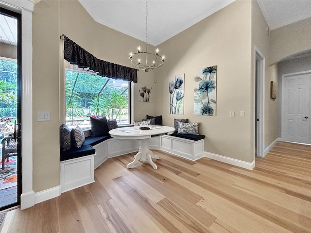 6567 Eagle Ridge Way, Lakeland, FL 33813 - dining space with breakfast area, light wood-style floors, baseboards, and a chandelier