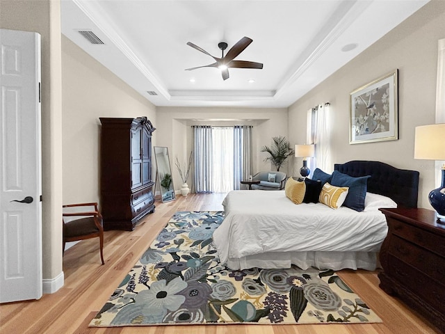 6567 Eagle Ridge Way, Lakeland, FL 33813 - bedroom featuring a raised ceiling, light wood-style flooring, recessed lighting, ceiling fan, and baseboards