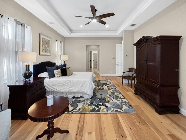6567 Eagle Ridge Way, Lakeland, FL 33813 - bedroom with a raised ceiling, light wood-type flooring, recessed lighting, and ceiling fan