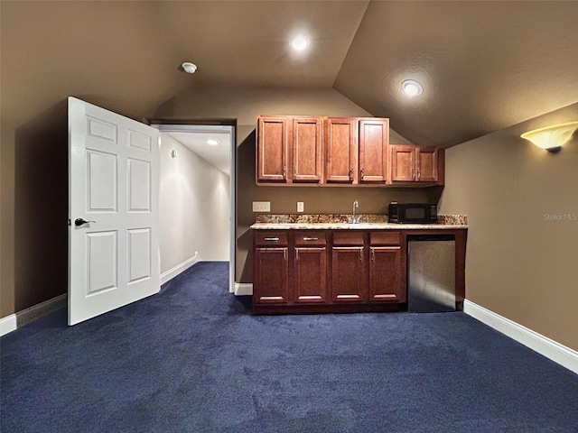 6567 Eagle Ridge Way, Lakeland, FL 33813 - kitchen with black microwave, vaulted ceiling, a sink, light countertops, and dark carpet