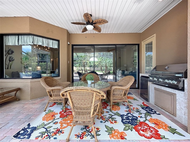 6567 Eagle Ridge Way, Lakeland, FL 33813 - sunroom featuring ceiling fan, outdoor dining area, and exterior kitchen