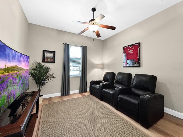 6567 Eagle Ridge Way, Lakeland, FL 33813 - home theater featuring wood finished floors, a ceiling fan, and baseboards
