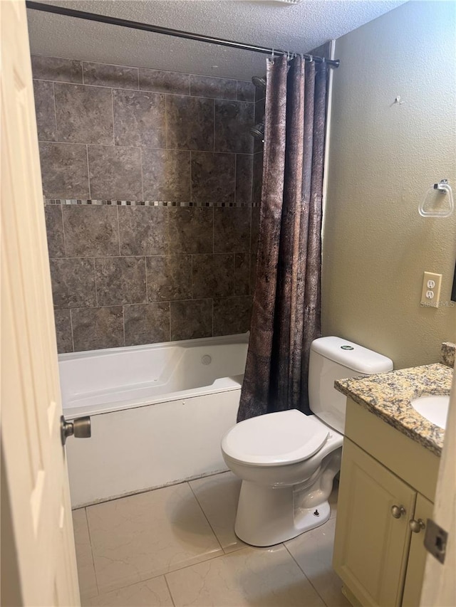 full bathroom with shower / bath combo with shower curtain, a textured ceiling, toilet, vanity, and a textured wall