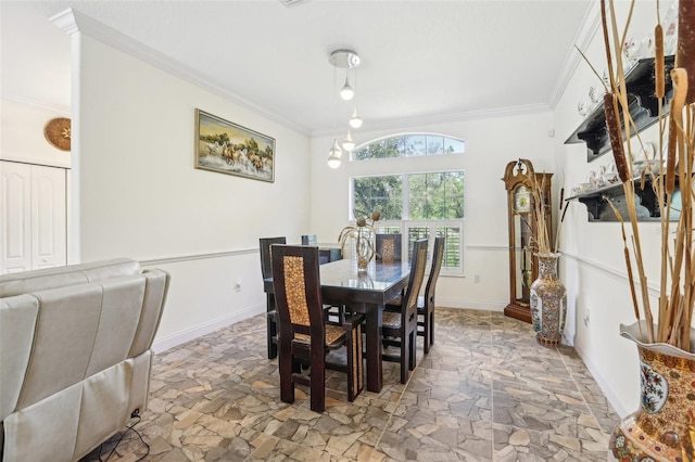 dining space featuring baseboards, stone finish flooring, and ornamental molding