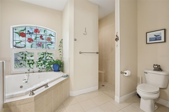 bathroom featuring a whirlpool tub, toilet, baseboards, walk in shower, and tile patterned flooring