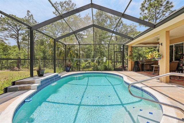 pool featuring a patio, a lanai, and grilling area