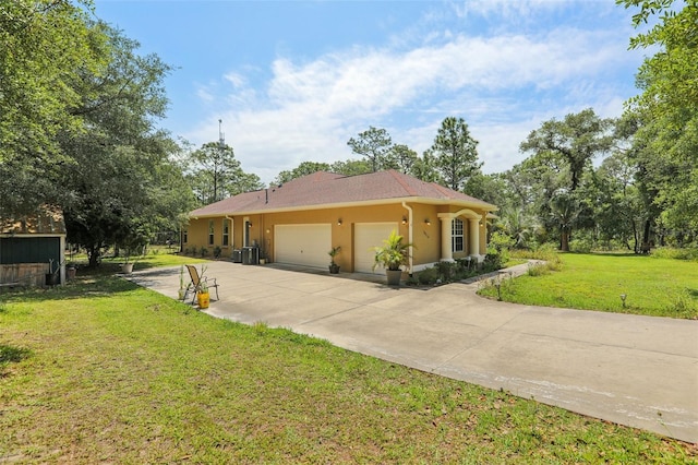 view of side of property featuring a lawn, driveway, stucco siding, and a garage
